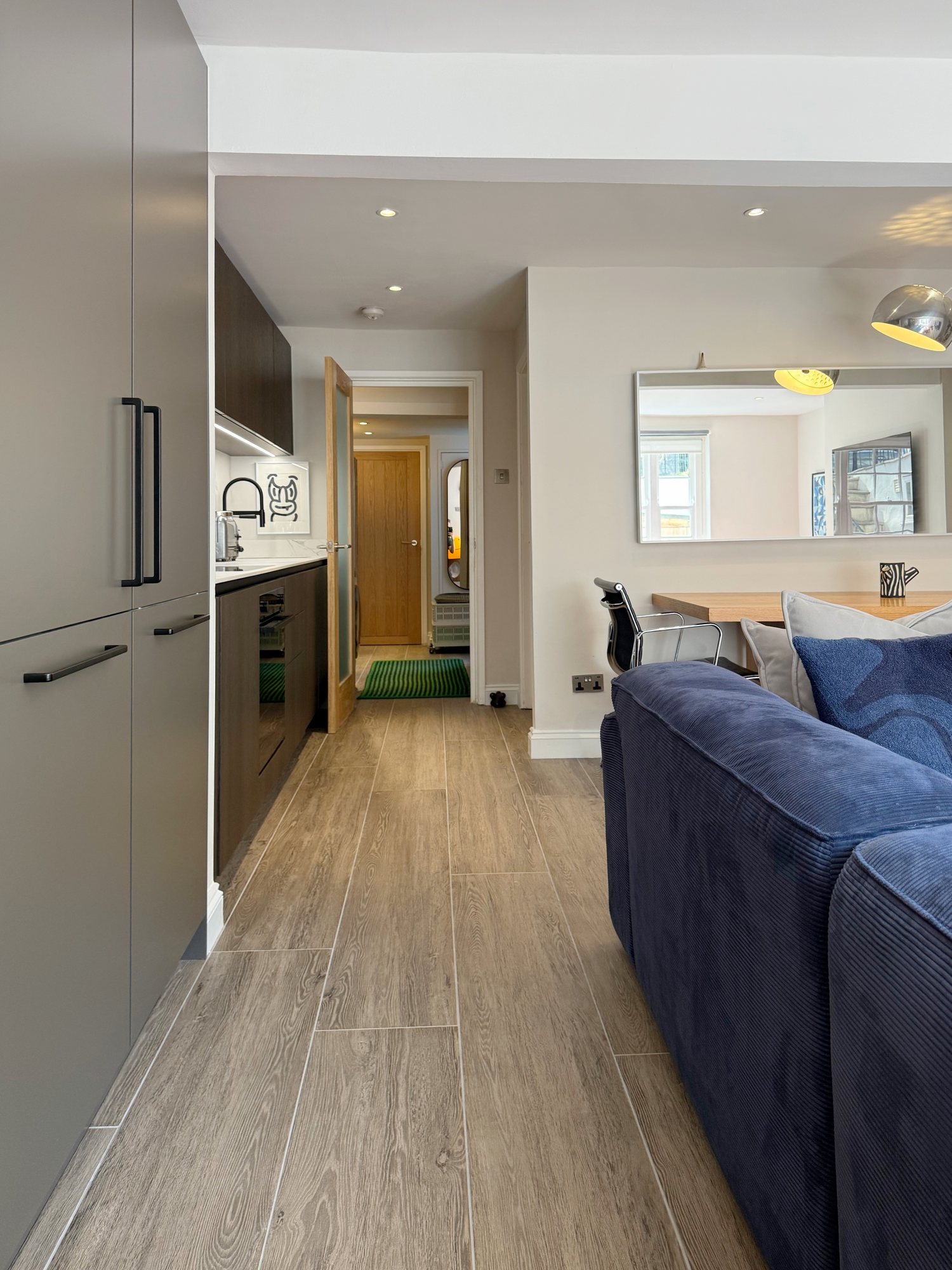 NoHi, the tall grey cupboards and the view down the hall
