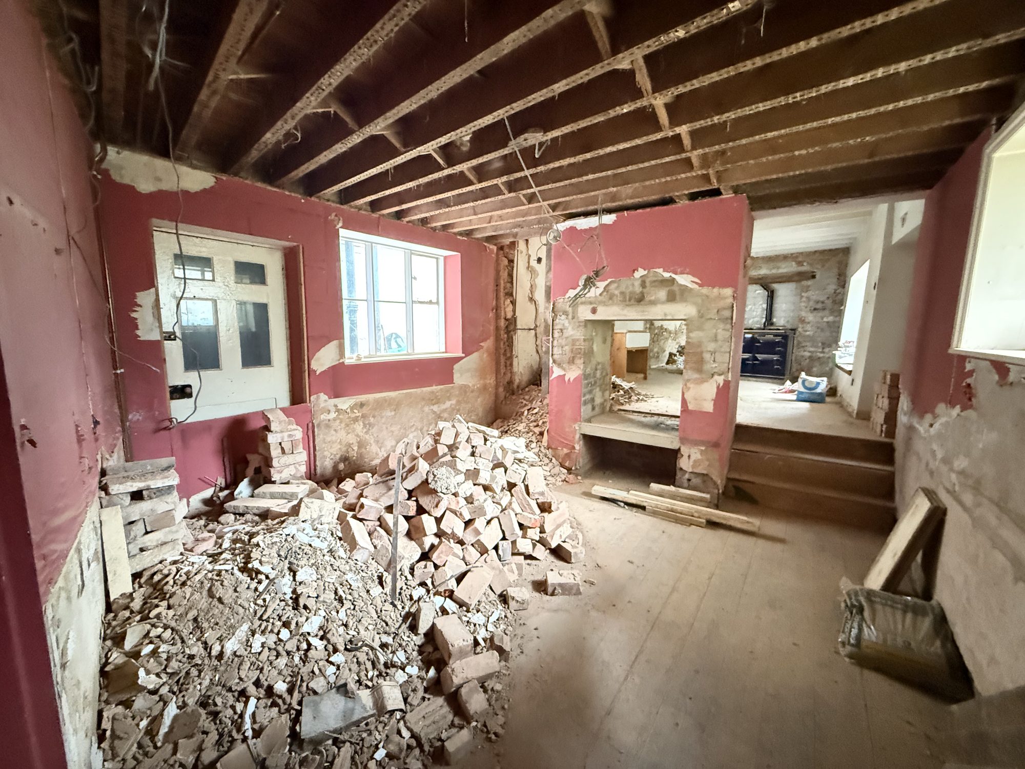 Sundial, as found: a red room, the fireplace opened up