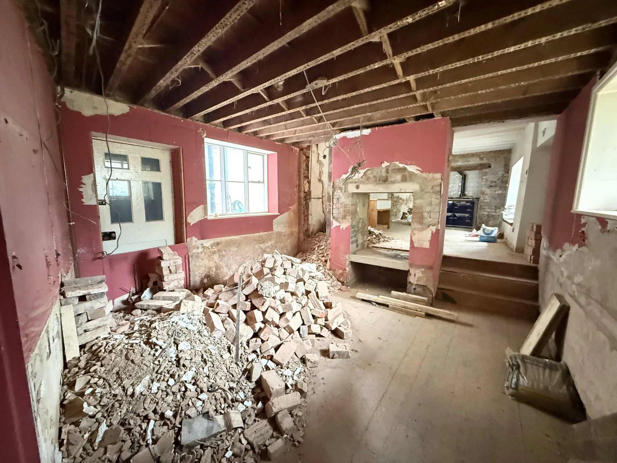 Sundial, as found: a red room, the fireplace opened up