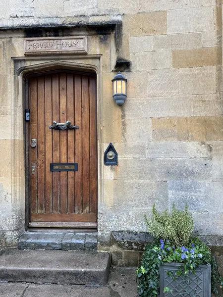 Sundial, an oak door in a stone surround, Chipping Campden