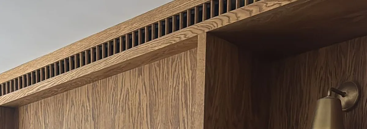 A Walk in the Park, the slatted ventilation grille along the top of the fireplace unit