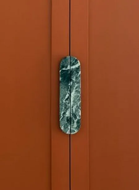 A Walk in the Park, a green Verde Alpi marble handle on the terracotta wardrobe